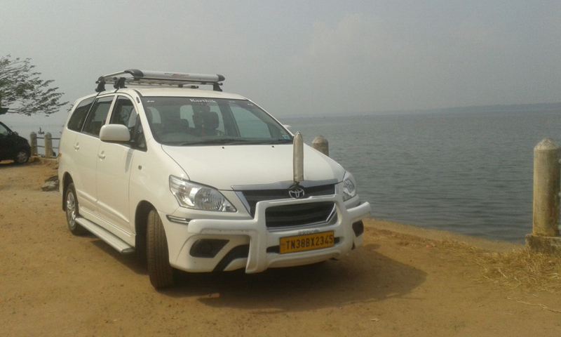 Karthik Travels car near water